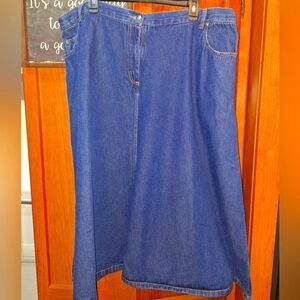 A Roaman's Denim Blue Midi Skirt in a size 26W. Pre-loved in great condition